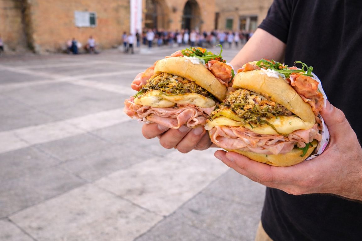 Traditional mortadella sandwiches with cheese and local condiments photographed during a Bologna Italy Food Tours food tour in the heart of Bologna.
